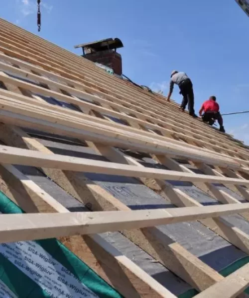 two-builder-on-an-open-rooftop-1.webp